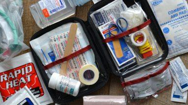 A first aid kit for disaster preparedness on a table.
