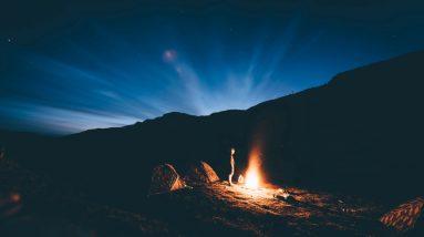 Survive the Apocalypse around a campfire in the mountains.